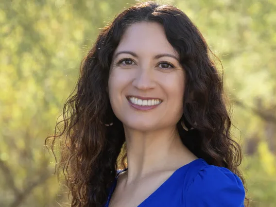 Headshot of Celina Ramirez wearing blue shirt