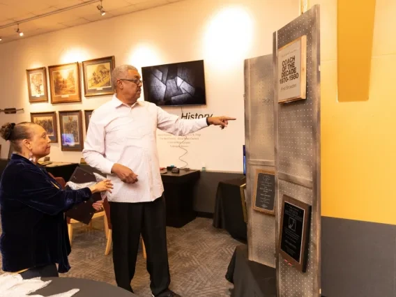 Beverely and Bob Elliott, co-founders of the African American Museum of Southern Arizona, put the finishing touches on an exhibit